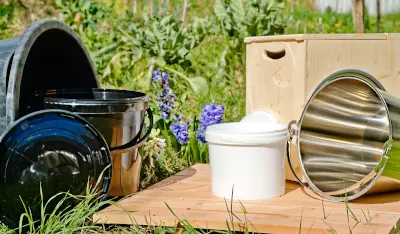 Buckets and containers for dry toilets